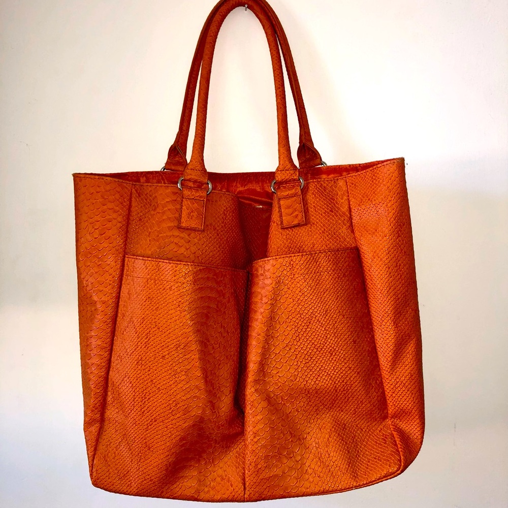 Neiman Marcus orange shoulder bag great for a luncheon with friends.